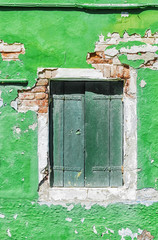 Wall Mural - old facade with a window on the island of Burano, Venice