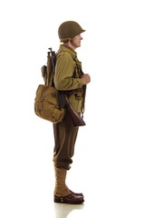 Man actor in military uniform of American ranger of World War II period posing against white background