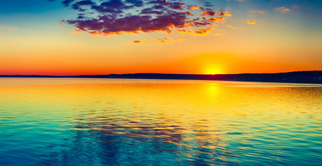 Wall Mural - sunset over the lake. amazing panorama landscape