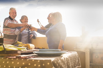 senior group barbeque on the terrace outdoor