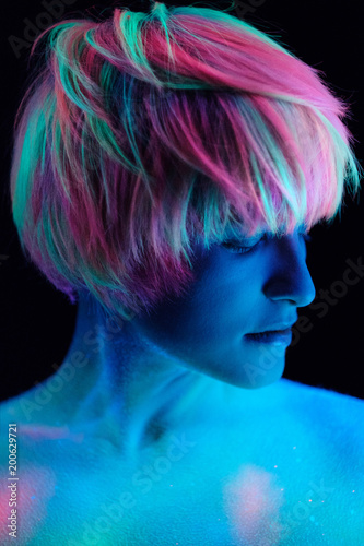Model Young Beautiful Portrait In Studio Makeup Neon Colors Makeup Neon Colors Ultraviolet Lamp Color Make Up Creative Glows In The Dark Hair Coloring With Paints Body Art Is Blue Green Orange