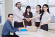 © Creativa Images - Young business people shaking hands in the office