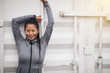 © Flamingo Images - Sporty young Asian woman leaning against a wall outdoors