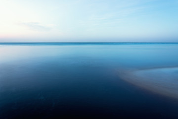horizontal line of calm sea on the day light