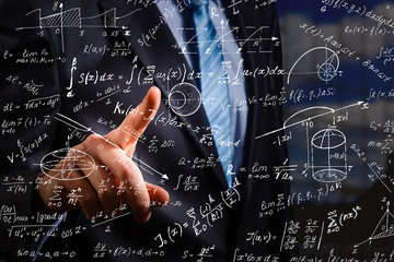 Wall Mural - Side portrait of handsome young businessman writing mathematical formulas on bright city background