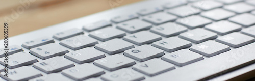 Fotomural Computer keyboard and on the desk close up.