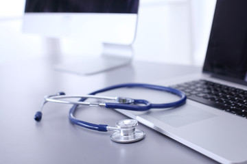 Wall Mural - Medical equipment: blue stethoscope and tablet on white background. Medical equipment