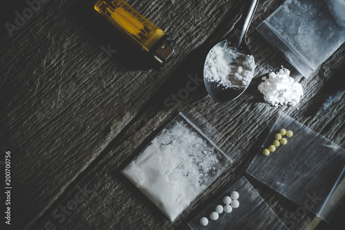Hard drugs on wooden table Poster Mural XXL