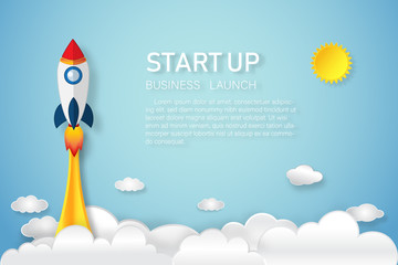 Rocket launch on the clouds and blue sky as paper art, craft style and business Startup project concept. flat design vector illustration.