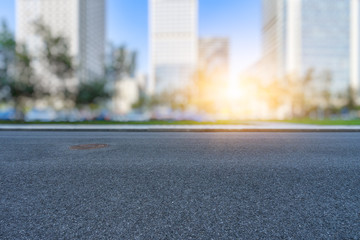 city empty traffic road with cityscape in background.