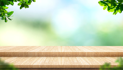Aufkleber - Empty step plank wood table top with blur tree in park with bokeh light background and leaves foreground,Mock up template for display of your design,Banner for advertise of product,panorama view