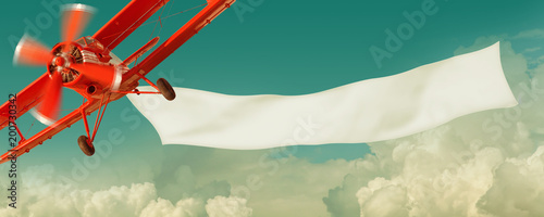 Cuadros en Lienzo Vintage red airplane flying in the sky with a white blank banner