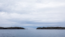 The Rovaer Archipelago In Haugesund, In The Norwegian West Coast. Ocean, Islands And Sky With Clouds.