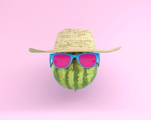 Summer times of funny attractive watermelon in stylish sunglasses with hat on pink background. minimal fruit concept. Creative idea foods and drinks that are typically enjoyed at summer festivals