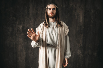 Wall Mural - Jesus Christ reaching out his hand, peace symbol