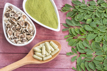 Canvas Print - Moringa leaves, seeds, powder and capsules - Moringa oleifera