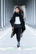 © nenetus - Beautiful asian young woman walking and looking the views in the street.