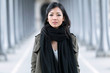 © nenetus - Fashion asian young woman posing and looking at camera in the street.