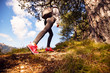 © Novak - Low angle view of female hiker outdoor