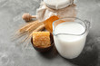 © New Africa - Beautiful composition with milk and honey on grey background