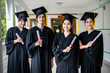 © WS Films - Group of multiethnic students with diplomas.