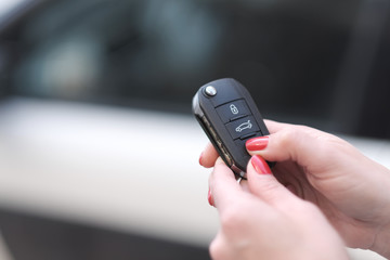 The control panel of the car and its signaling in the hands of a woman