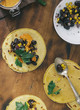 Vegetarian healthy corn tortillas with vegetables on wooden table, top view. Tasty and healthy food concept