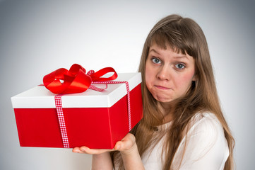 Pretty smiling woman with red gift box