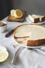 Wall Mural - Lemon cheesecake on a table, selective focus. Still life of cheesecake