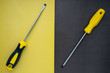 screwdrivers on a yellow black background