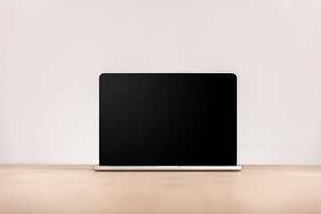 Wall Mural - isolated laptop with black screen and copy space in front of white background