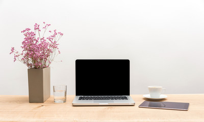 Wall Mural - Laptop with copy space and tablet on wooden desk with white background