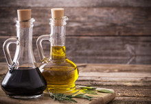 Olive Oil And Balsamic Vinegar On A Wooden Background