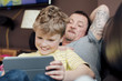 © dglimages - Playing on a Digital Tablet with Dad