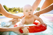 Little Baby Boy In The Swimming Pool.