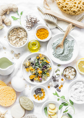 Wall Mural - home beauty products - clay, oatmeal, coconut oil, turmeric, lemon, scrub, dry flowers and herbs, sp
