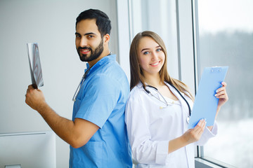 Male and female doctors work together in hospital