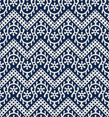  Woodblock printed indigo dye seamless ethnic floral geometric pattern. Traditional oriental ornament of India Kashmir, loach with chevron motif, navy blue on ecru background. Textile design.