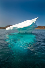Wall Mural - blue-white ice in the sea. classic little iceberg in north-west passage.