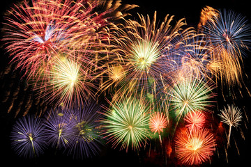 Wall Mural - multicolor fireworks over dark sky