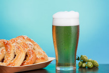 Pint Of Beer With Ingredients For Homemade Beer, Blue With Pretzel