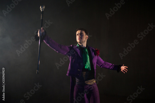 Showman. Young male entertainer, presenter or actor on stage. The guy in  the purple camisole and the cylinder. - Buy this stock photo and explore  similar images at Adobe Stock | Adobe Stock