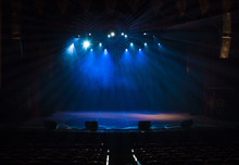 An Empty Stage Of The Theater, Lit By Spotlights And Smoke Before The Performance