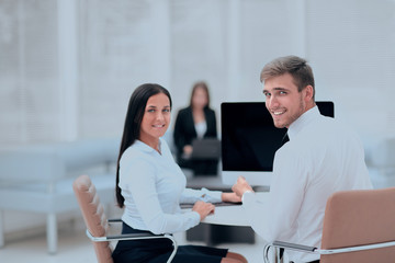 Canvas Print - members of the business team sitting at Desk and looking at camera .