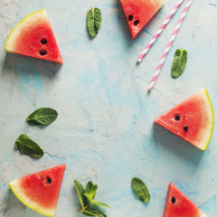 Wall Mural - Frame of watermelon slices and mint on blue texture