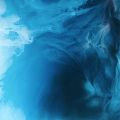 Wall Mural - full frame image of mixing of blue, black and white paints splashes  in water