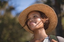 Young Woman In Straw Hat Outdoors