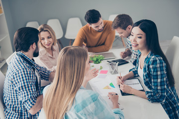 Wall Mural - Attractive stylish beautiful positive confident handsome financiers managers sitting at desk speaking, communicate, discussing, expressing opinions, view, mind,  partnership, unity, enjoying work time