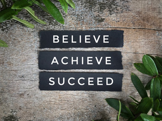 Motivational and inspirational quotes - Believe, achieve, succeed. With vintage-styled background.