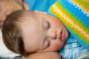 Wall Mural - Cute baby boy with Down syndrome playing with dad on in home living room